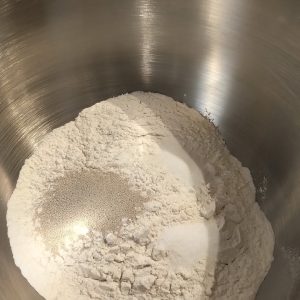 In a bowl, place the flour, yeast, salt and sugar