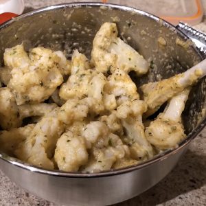 Dip the florets in the mixture, coat them well.