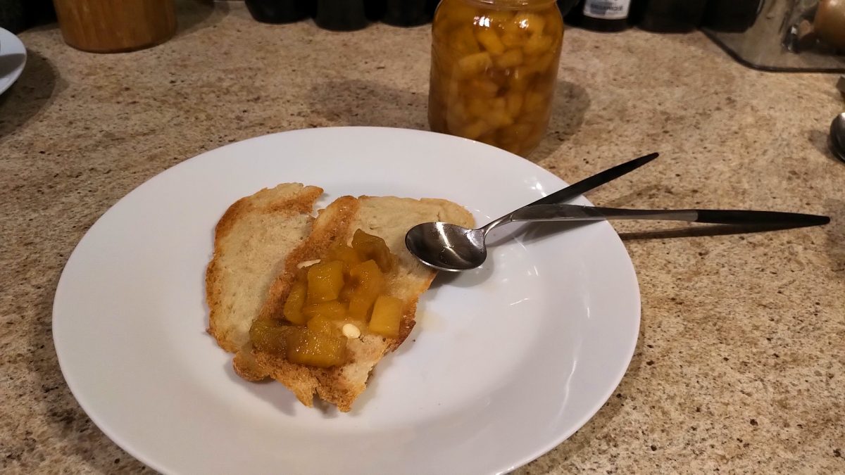 Pineapple jam on cracker with a little bit of butter