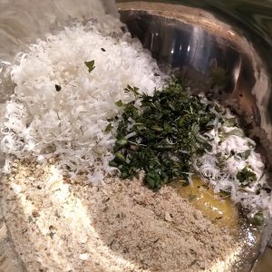 In a bowl, beat the eggs, grated cheese, breadcrumbs, flour, fresh herbs, salt and pepper until well combined.