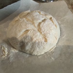 Score the bread in a checkerboard pattern.